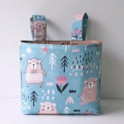 beige farbene Hängetasche mit schwarzen Outline Tieren